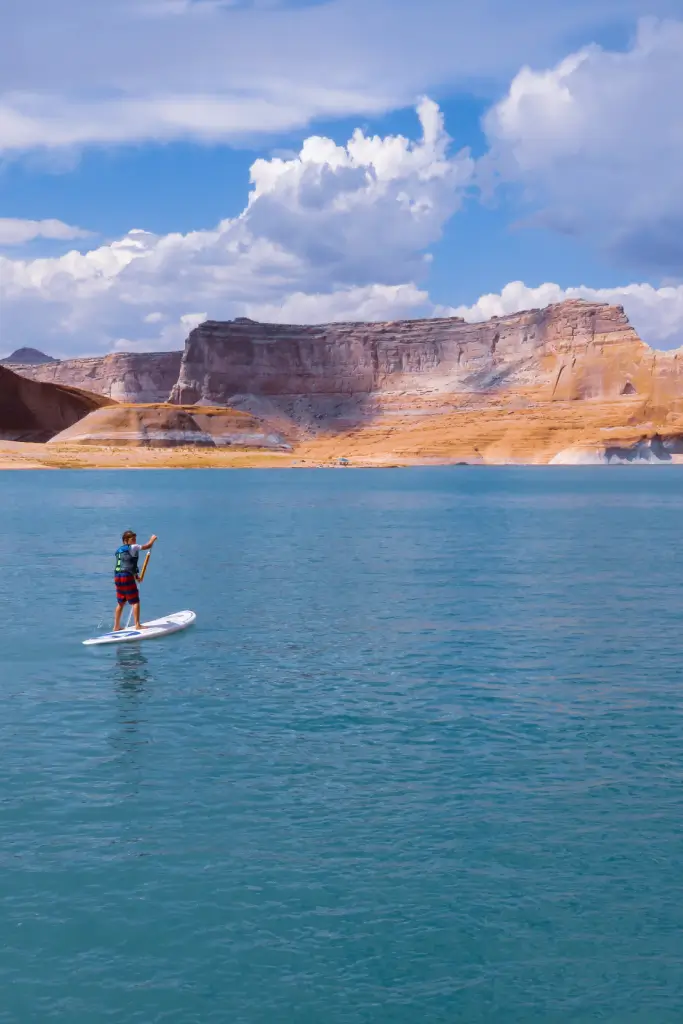 man kayaking through lake powell to reach antelope canyon