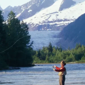 woman fishing in river alaska